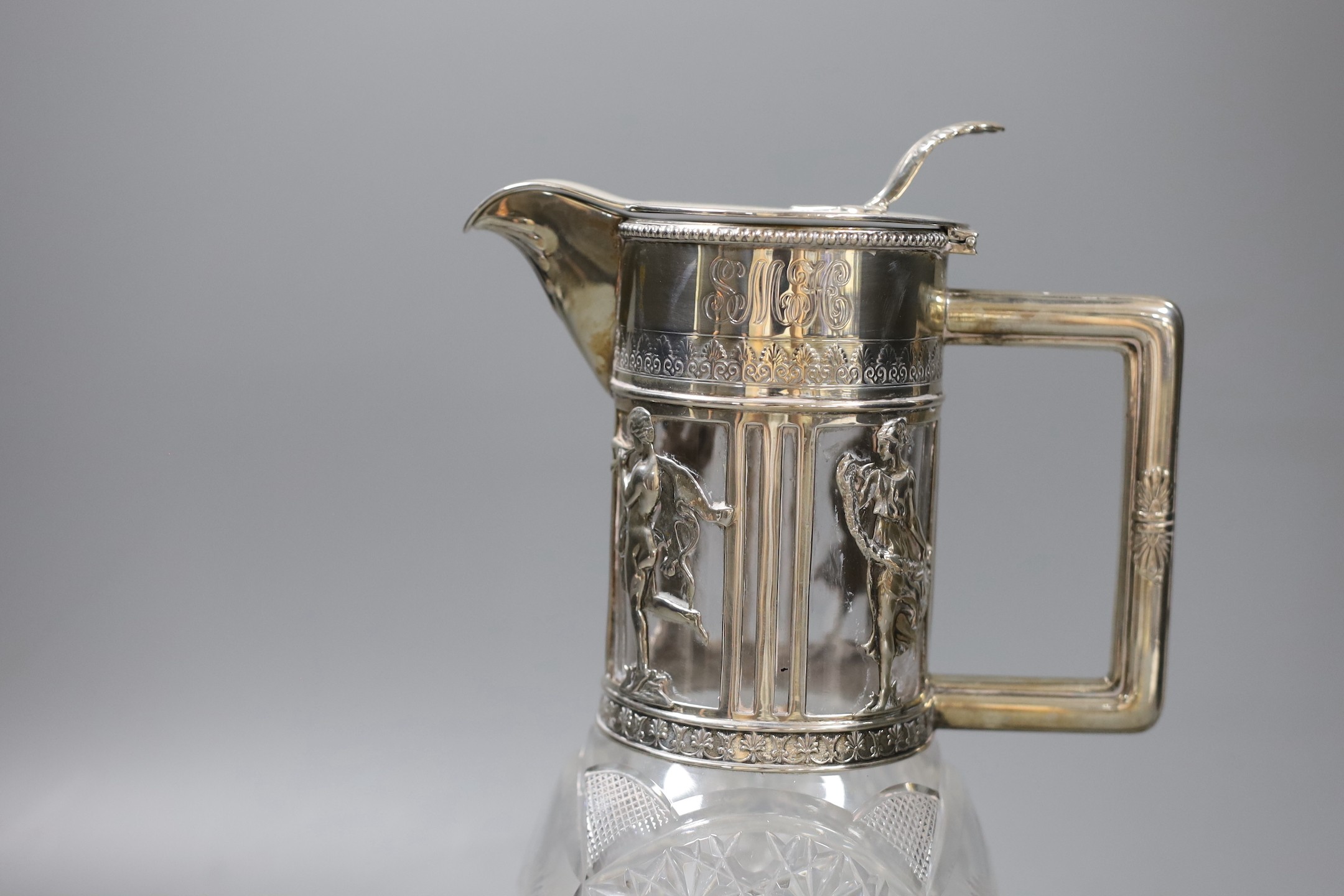 A late 19th/early 20th century German 800 standard white metal mounted cult glass claret jug, retailed by Friedlaender, height 26.2cm.